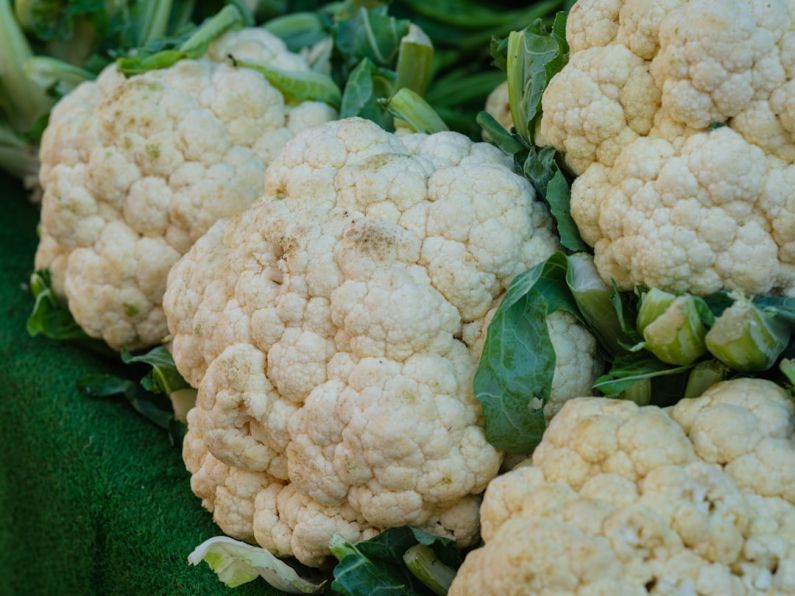 Shopping Locally - a close up of cauliflower on display for sale