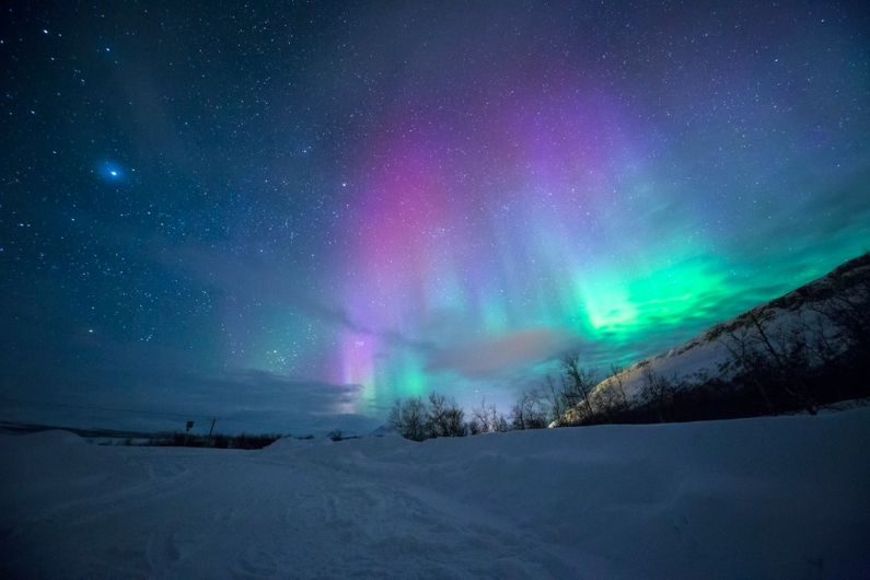Northern Lights - northern lights over snow-capped mountian