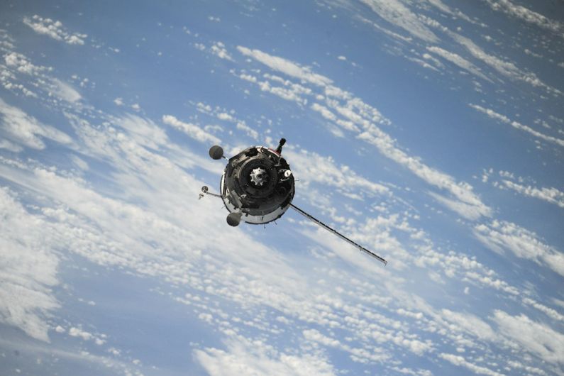 Decluttering Space - satellite flying on space
