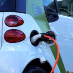 Electric Vehicle Technology - White and Orange Gasoline Nozzle