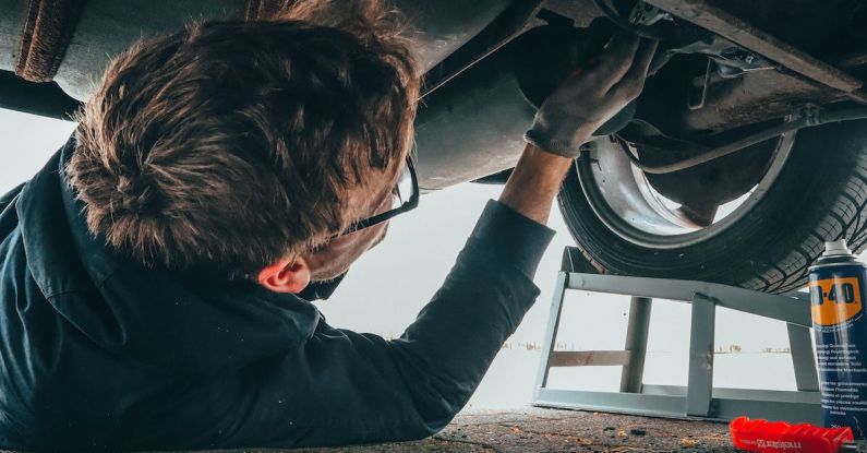 Car Maintenance Importance - Man Fixing Vehicle Engine