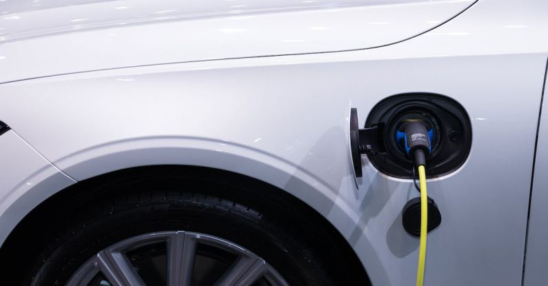 Hybrid Car Benefits - White Car Charging