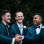 Engaging Content - Happy groom with groomsmen on street