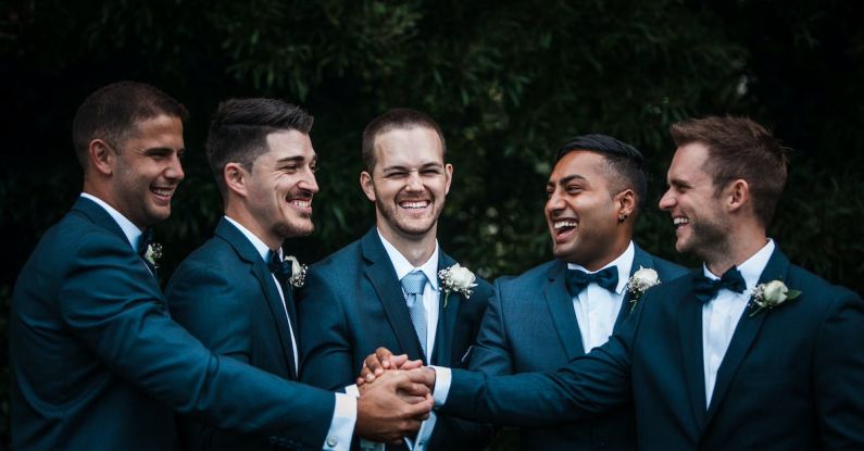 Engaging Content - Happy groom with groomsmen on street