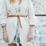 Fast Fashion Impact - woman in white coat
